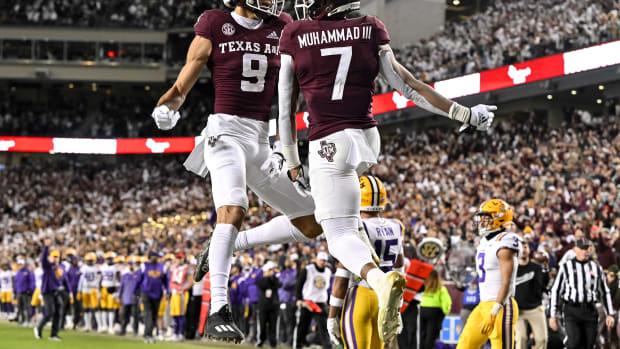 Texas A&M football players celebrate a touchdown.